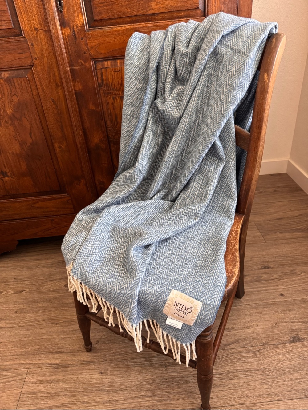 Nido Notte Italia blue herringbone throw blanket with cream tassels